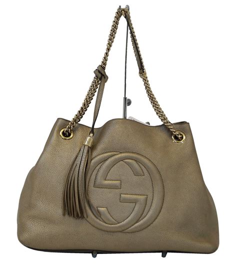 gucci logo gold doks|Gucci tote bag.